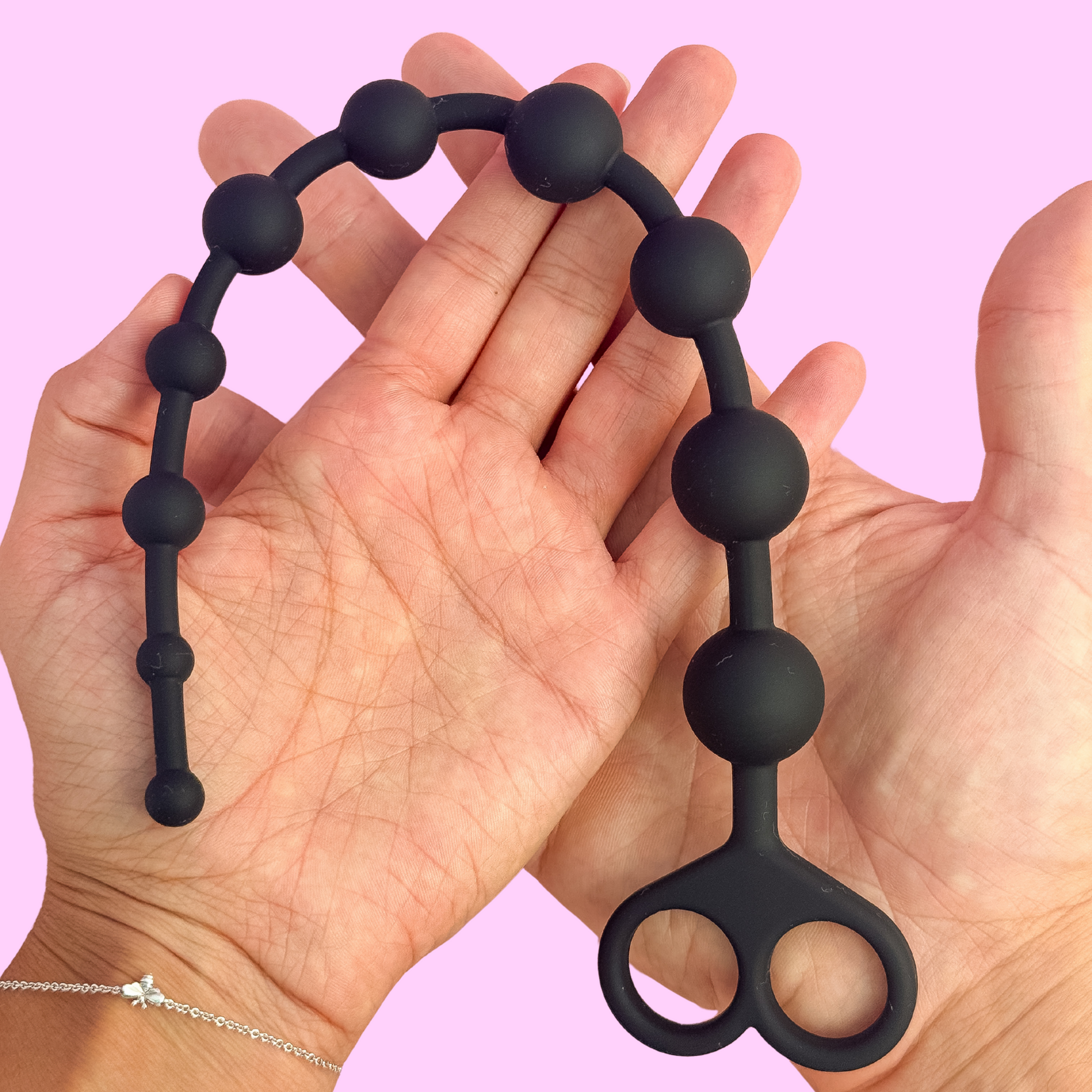 Flexible silicone anal beads showing smooth bead design and tapered shape