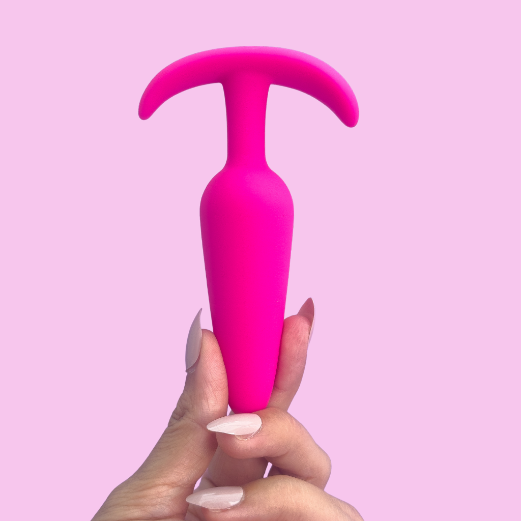 Flared butt plug adult toy for stretching anus.