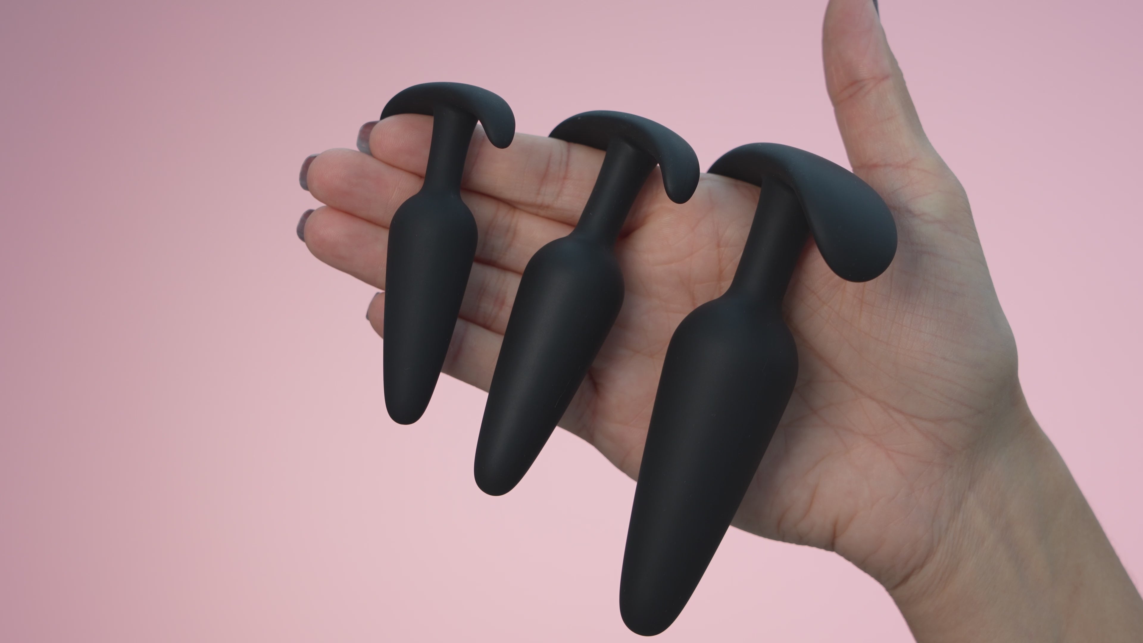 Load video: butt plugs for anal training for female and males in black, pink, purple and confetti. 