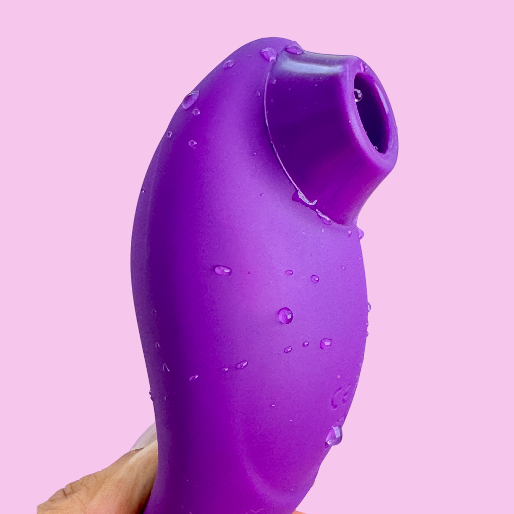 Purple clitoral suction toy with multiple intensity settings.